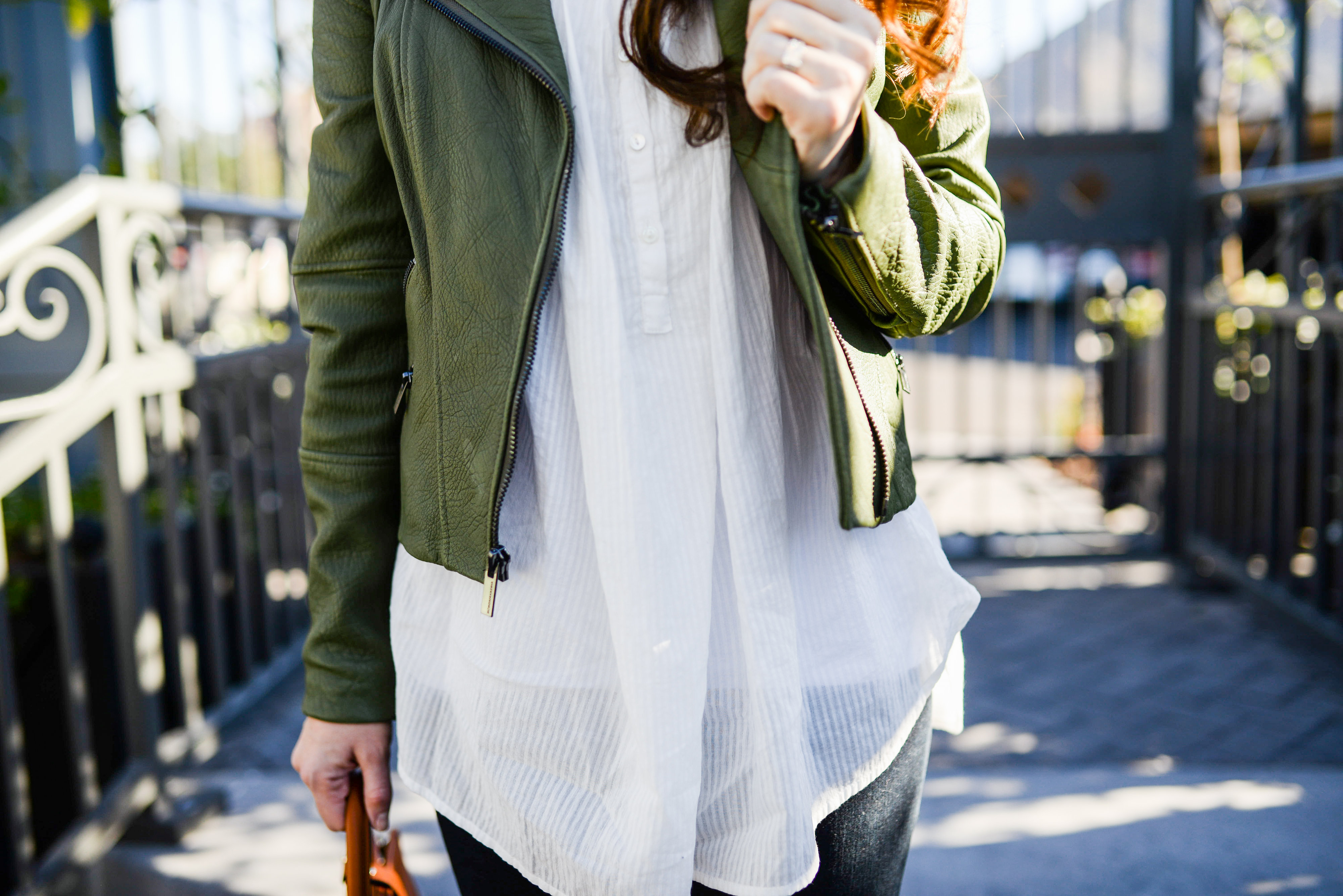 White shirt and military green leather jacket